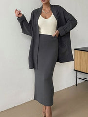 Dark gray ribbed knit co-ord set with open cardigan and pencil skirt, acrylic material.
