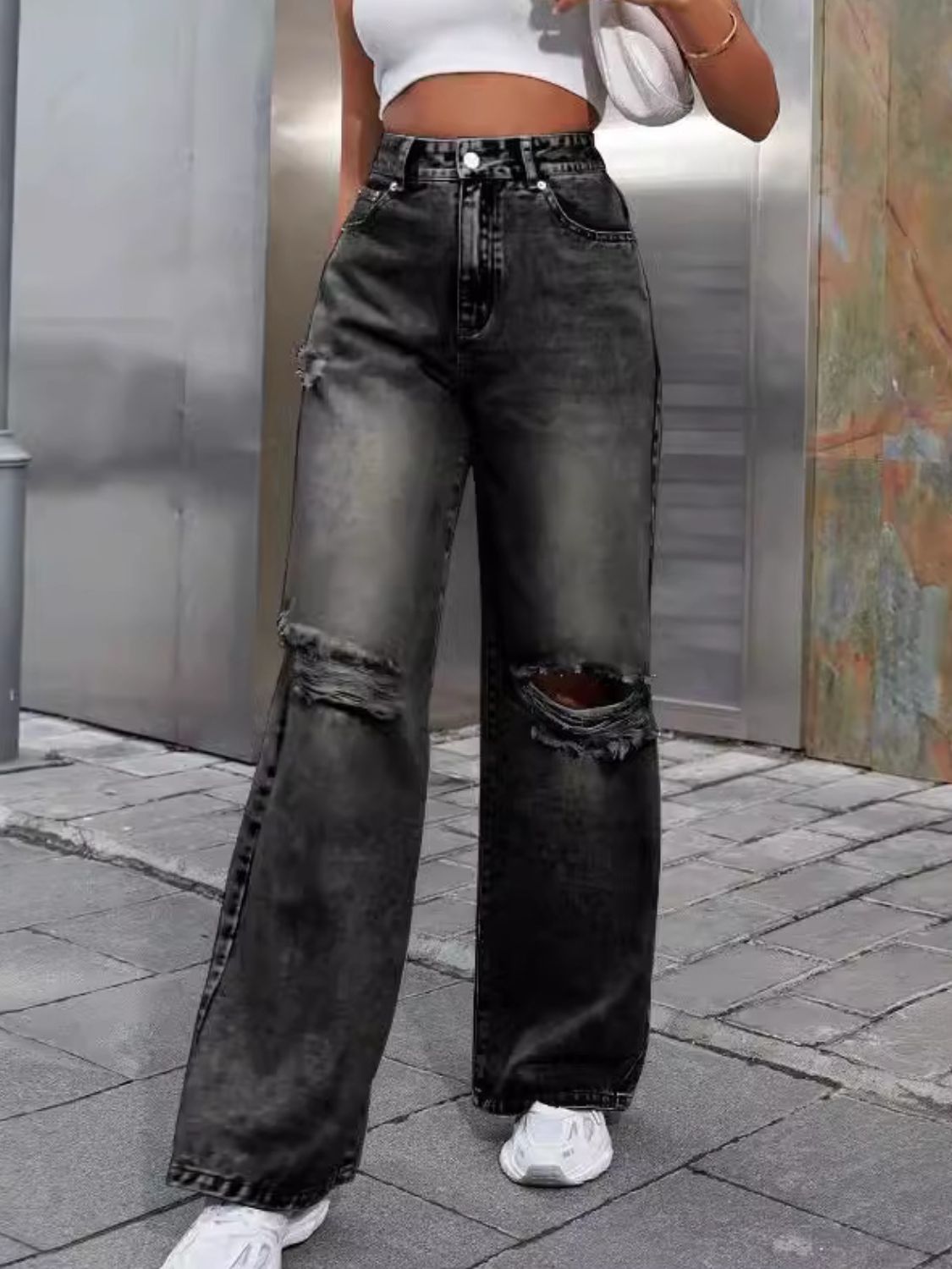 Distressed wash wide leg jeans in dark gray with ripped knees.