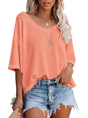 Coral pink waffle knit relaxed V-neck t-shirt with short sleeves.