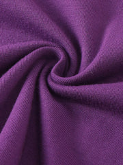 Purple ribbed knit fabric detail of a baby overall dress and tee set.