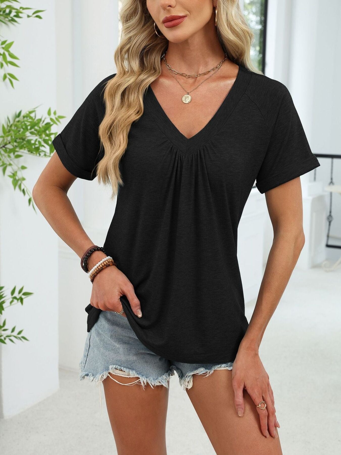 Ruched V-neck short sleeve t-shirt in black with elastane for comfort.