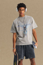 Acid wash graphic tee in gray with oversized fit and crew neck.