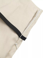 Cream maternity romper with black trim and side zipper detail