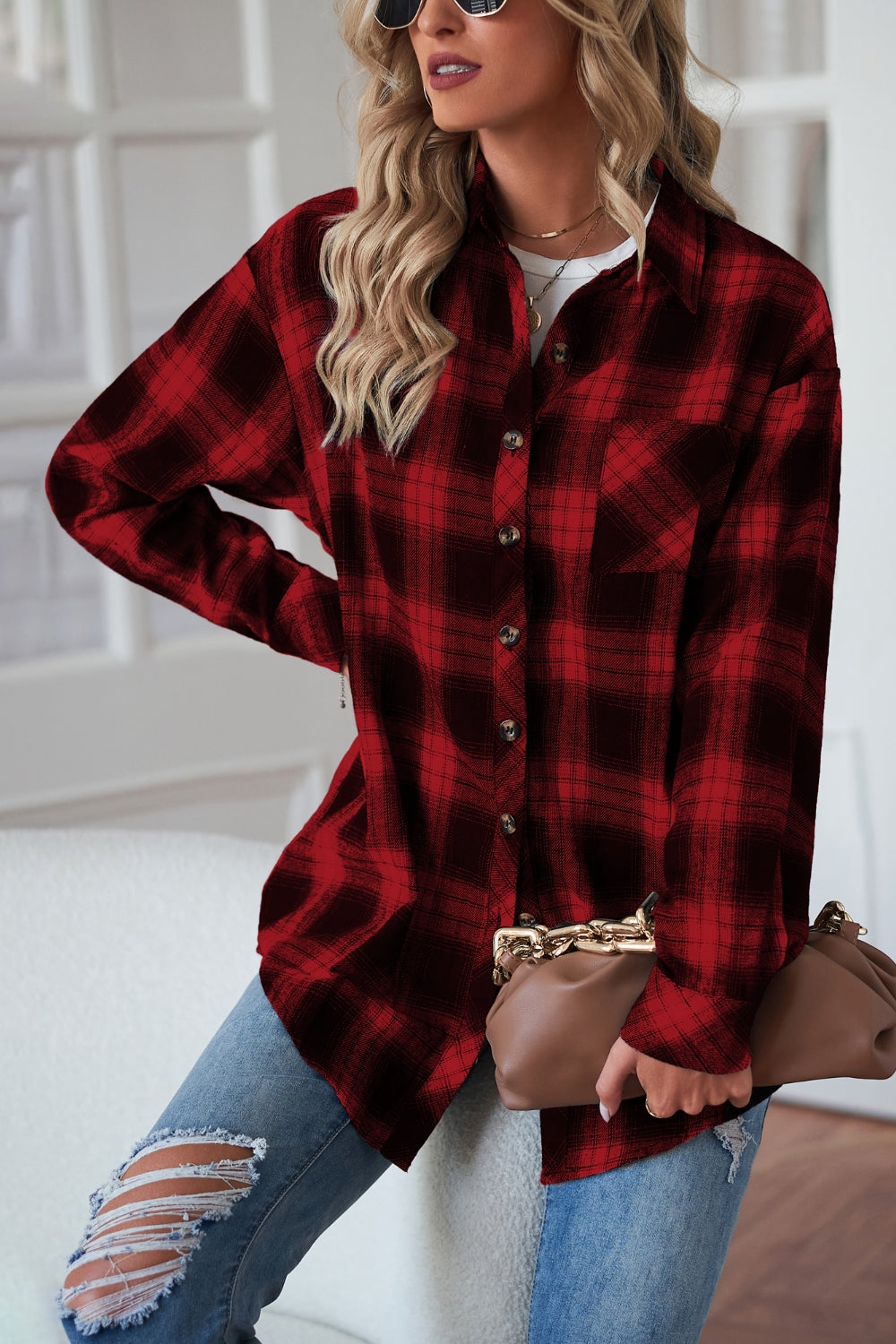 Red and black plaid drop-shoulder jacket with buttons and a chest pocket.