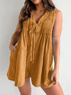 Caramel denim tie-front playsuit with V-neck and pleats.