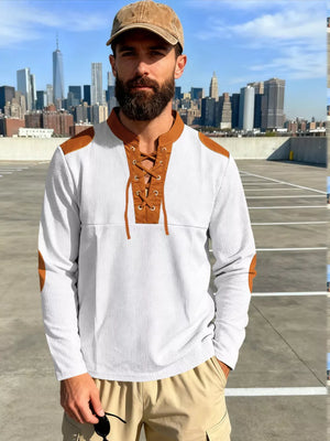Men's white long-sleeve t-shirt with brown lace-up neckline and elbow patches.