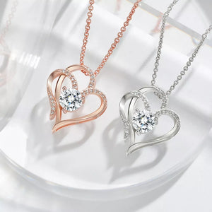 Elegant heart pendant necklace in sterling silver with cubic zirconia, available in rose gold and silver.
