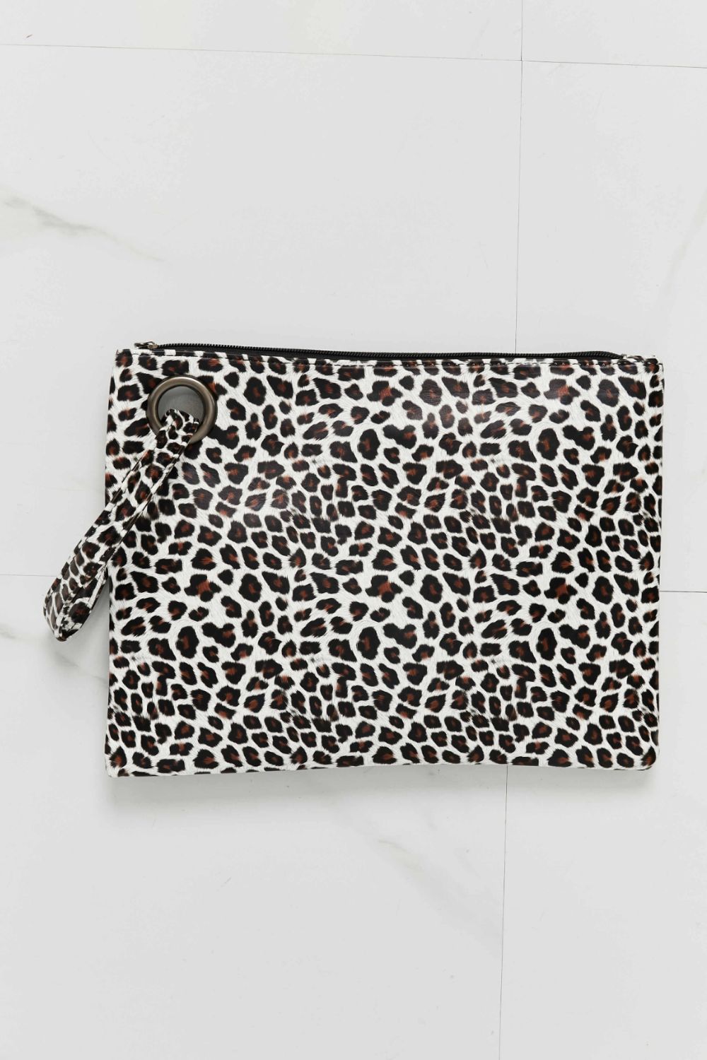 Leopard print wristlet pouch with metal ring detail and wrist strap.