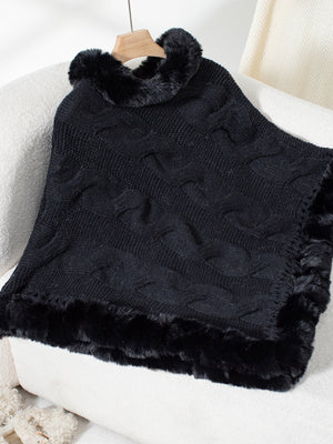 Black cable knit poncho with faux fur trim and collar detail.