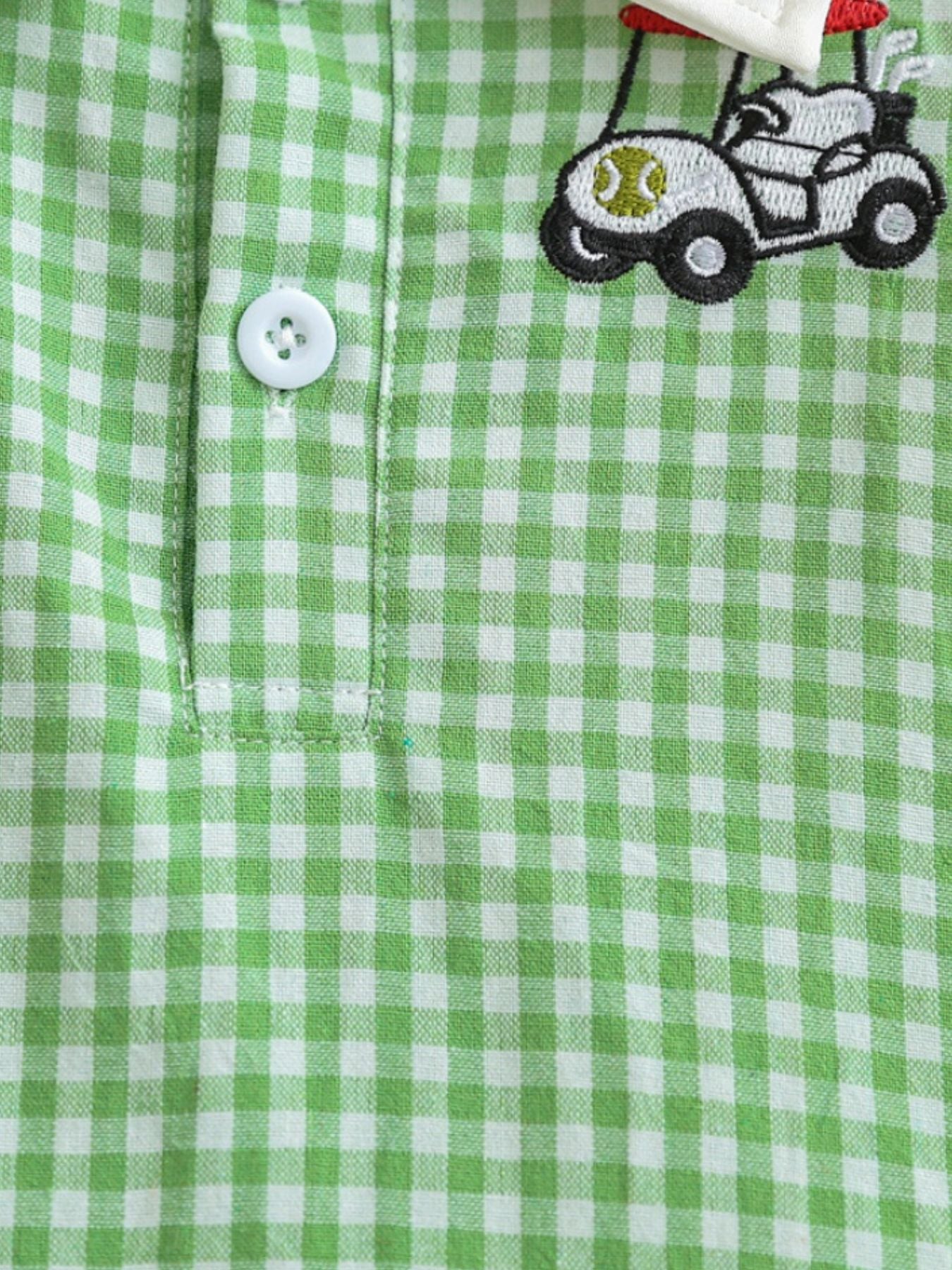 Gingham polo dress in Gum Leaf green cotton with a golf cart embroidery and white button detail.