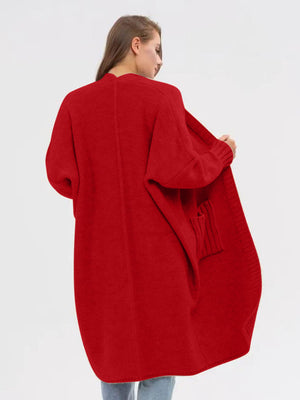 Oversized scarlet acrylic knit cocoon cardigan with pockets and ribbed cuffs.