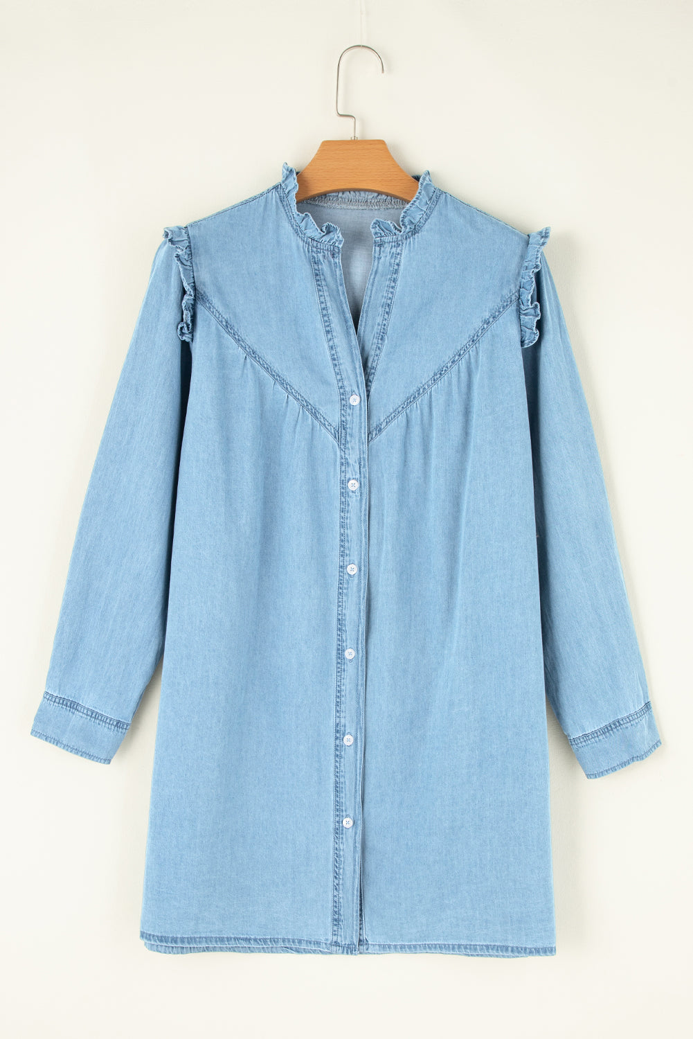 Light blue denim shirt dress with ruffled yoke and button front.