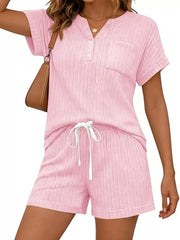 Pink ribbed knit loungewear set with drawstring shorts and henley top with pocket.