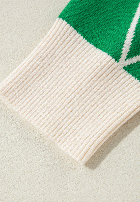Dark green argyle knit sweater with cream ribbed trim and neckline detail.