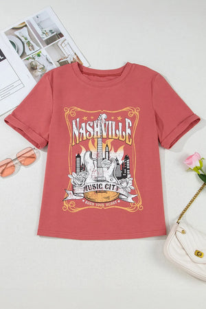 Burnt Coral graphic tee with Nashville Music City guitar and city skyline print.