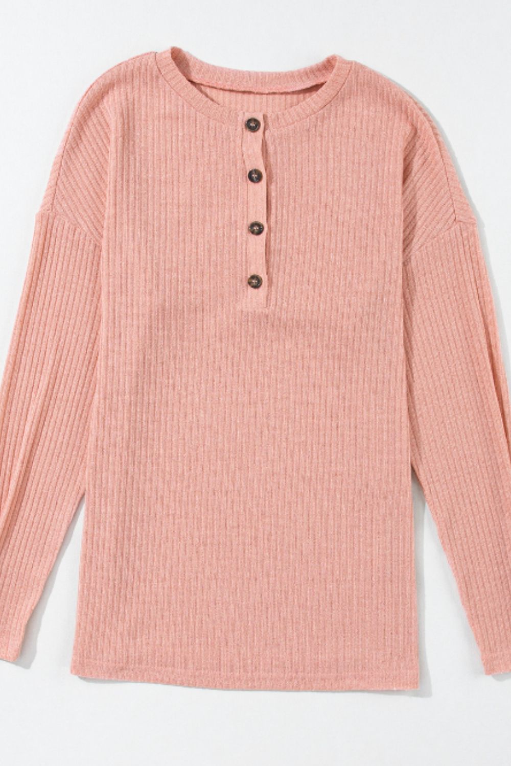 Dusty pink ribbed henley knit top with button detail and relaxed fit.