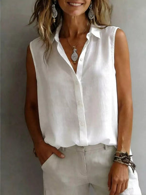 White sleeveless button-up shirt with a classic collar and button front.