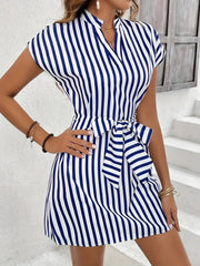 Blue and white striped mini dress with cap sleeves, V-neck, and self-tie waist.