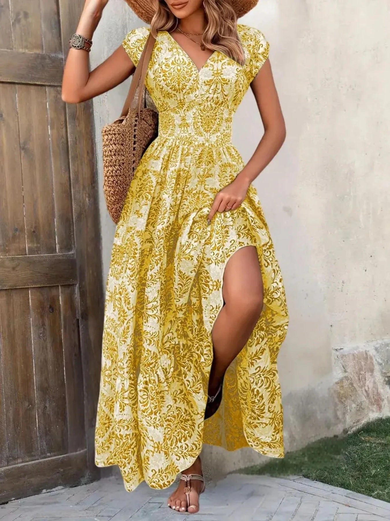 Yellow damask print cap sleeve maxi dress with a high slit and smocked waist.