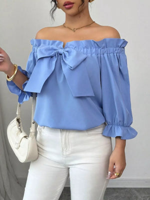 Sky blue off the shoulder blouse with ruffled neckline, bow detail and balloon sleeves.