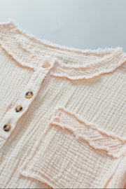 Beige gauze henley blouse with raw edge collar and pocket detail