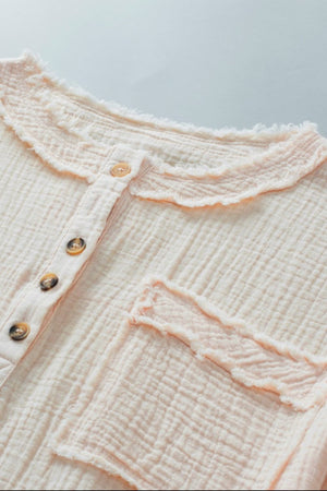 Beige gauze henley blouse with raw edge collar and pocket detail