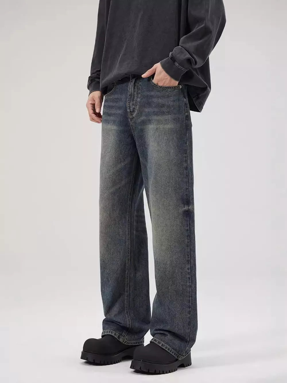Men's relaxed fit dark wash denim jeans with a vintage look.