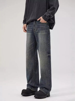 Men's relaxed fit dark wash denim jeans with a vintage look.
