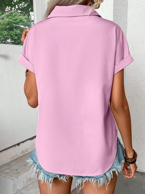 Pink purple polyester button-down shirt with cuffed short sleeves and a curved hem.