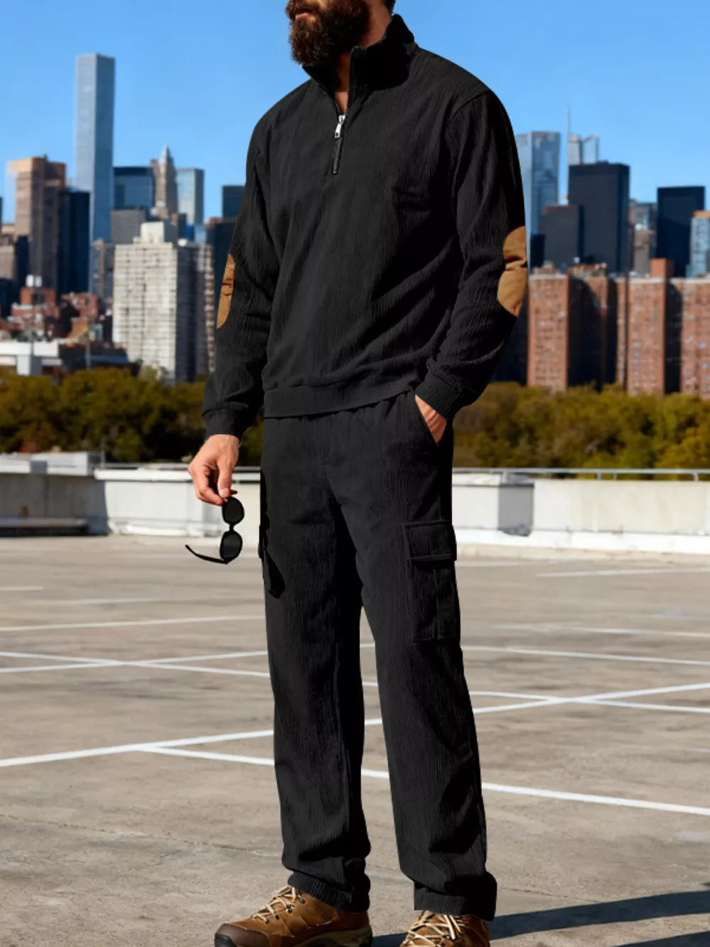 Black casual two-piece set with quarter zip pullover and cargo pants.