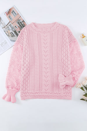 Pink openwork knit sweater with lace sleeves and ruffled cuffs.