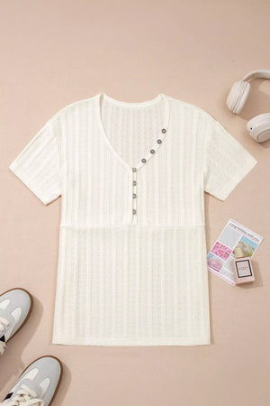Textured V-neck maternity t-shirt in cream with button details and short sleeves.