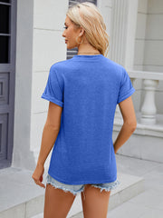 Blue casual t-shirt with rolled cuff sleeves and a button-down neckline.