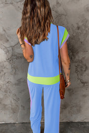 Colorblock sportswear set with contrast trim in light blue, lime green, and lavender.