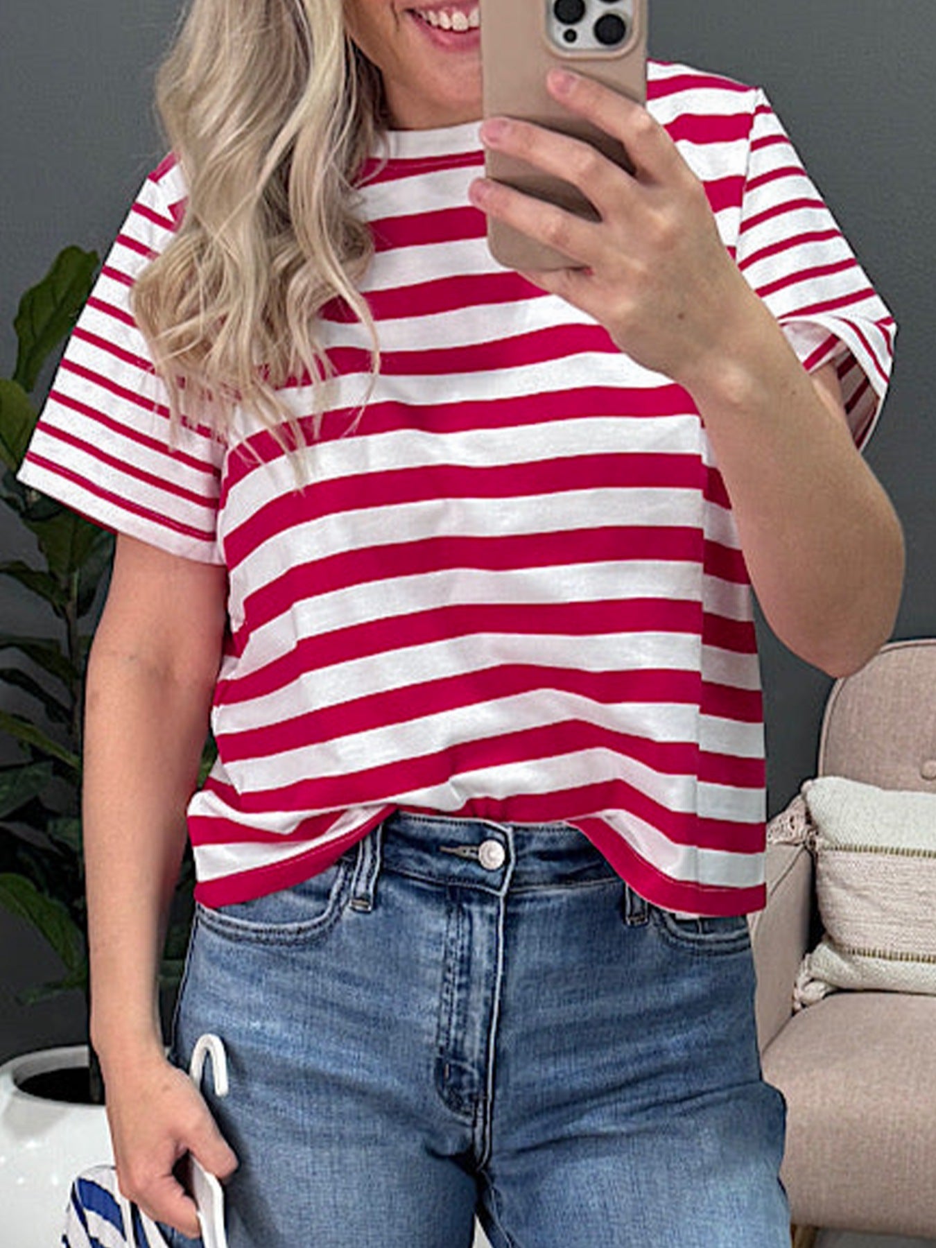 Red and white striped cotton blend t-shirt with a round neck and short sleeves.