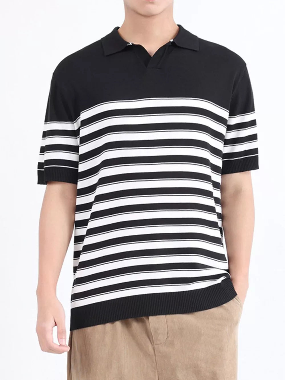 Men's black and white striped knit polo shirt with short sleeves and a spread collar.