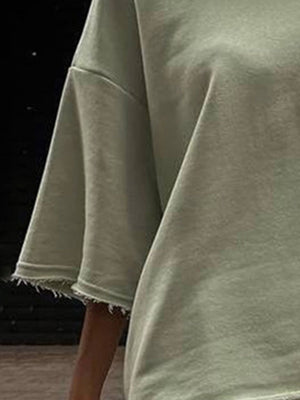 Sage raw-edge pocket tee with short sleeves and frayed cuffs