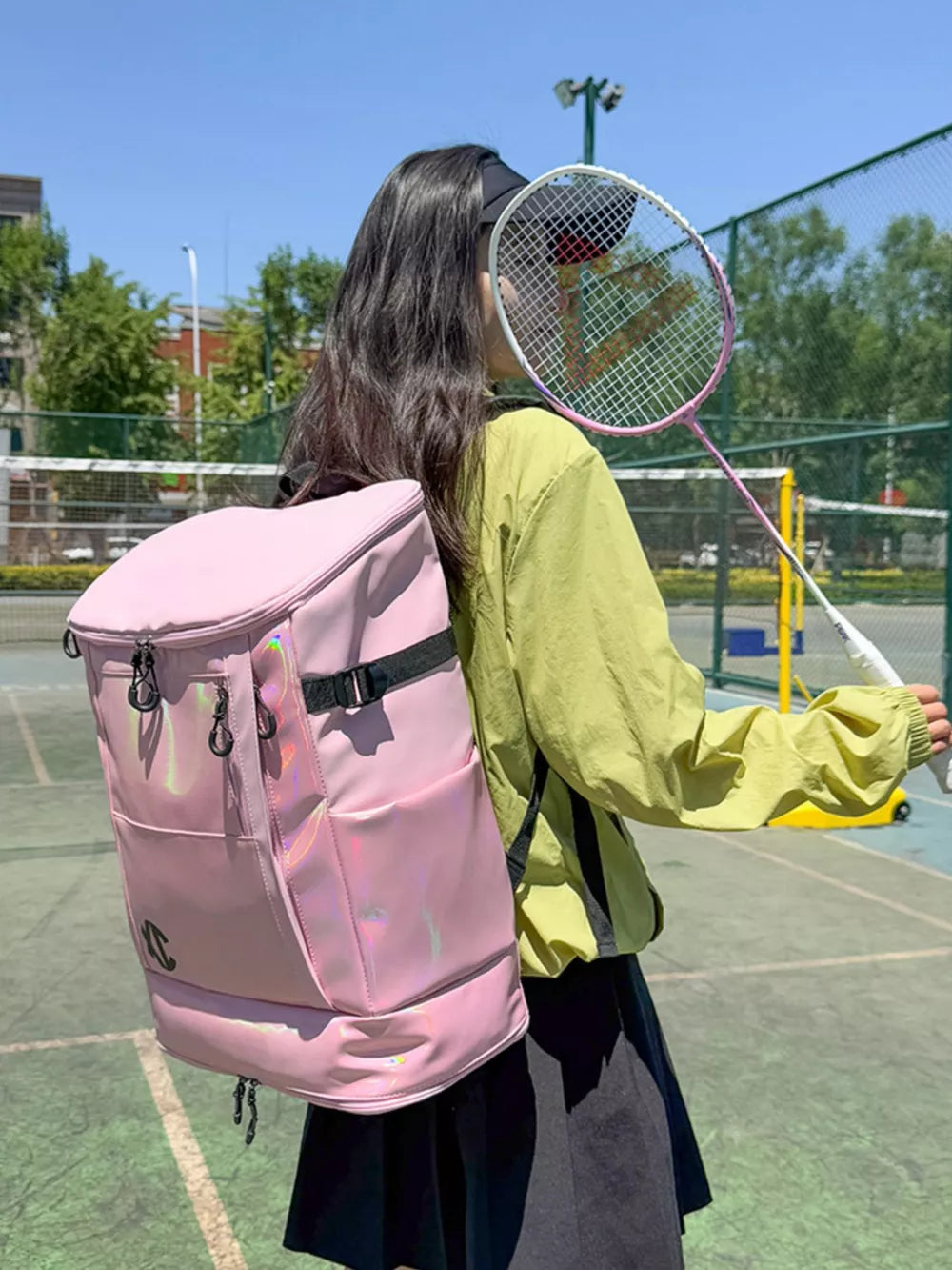 Spacious pink travel organizer bag with iridescent panel and buckle closure.