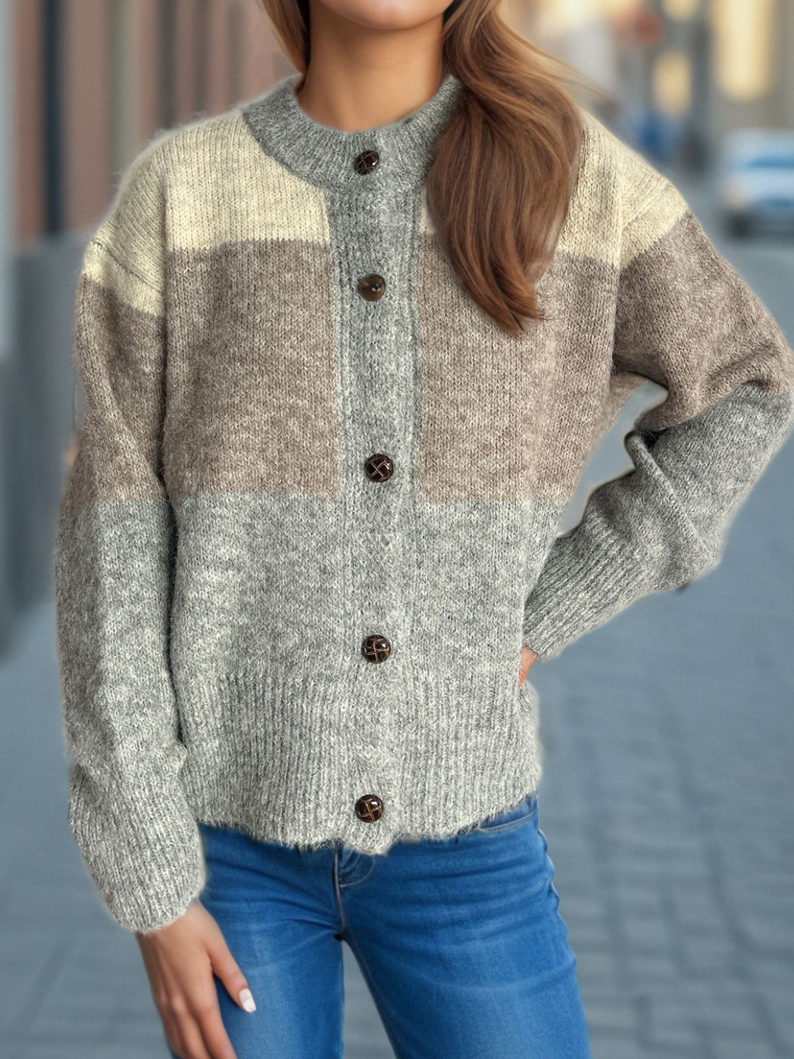 Colorblock crewneck button-down knit cardigan in acrylic with beige, brown, and gray stripes.