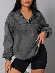 Chic quarter-zip denim sweatshirt in dark gray acid wash with elastic hem.