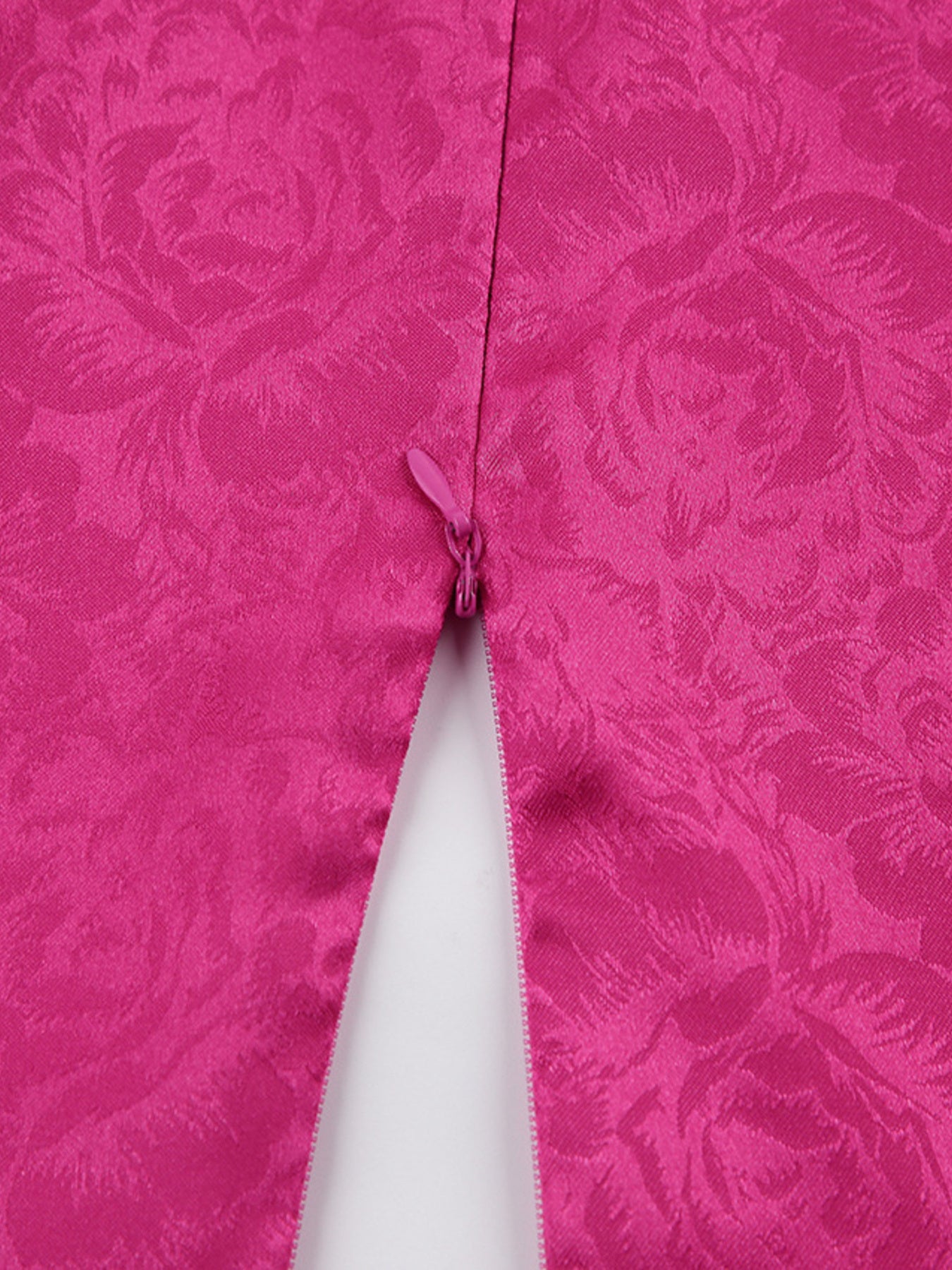 Vibrant cerise mini dress with rose jacquard pattern and back zipper detail