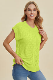 Lime green knit patchwork short sleeve top with varied textures and cable knit details.