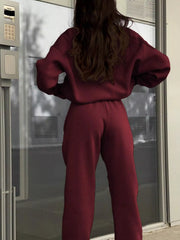 Burgundy half zip sweatshirt and matching pants set, casual athleisure outfit.