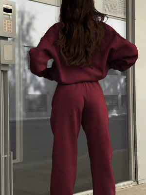 Burgundy half zip sweatshirt and matching pants set, casual athleisure outfit.
