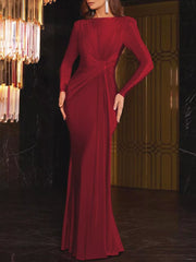 Red ruched long sleeve maxi dress with boat neckline and bodycon fit.