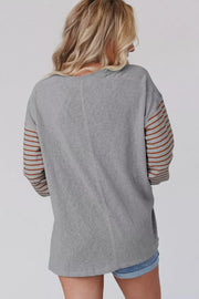 Gray maternity shirt with bishop sleeves featuring horizontal stripes