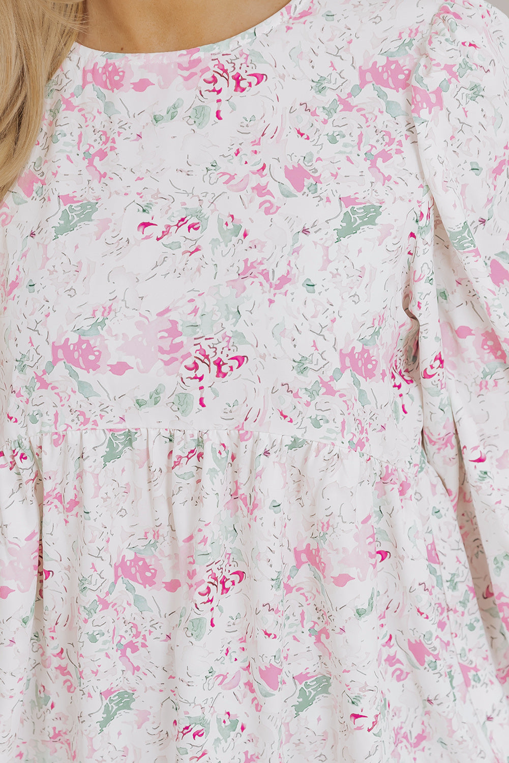 Blush pink floral print blouse with smocked waist and puff sleeves