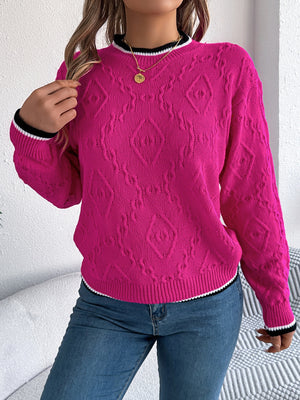 Hot pink acrylic sweater with diamond knit texture and contrast trim neckline and cuffs.