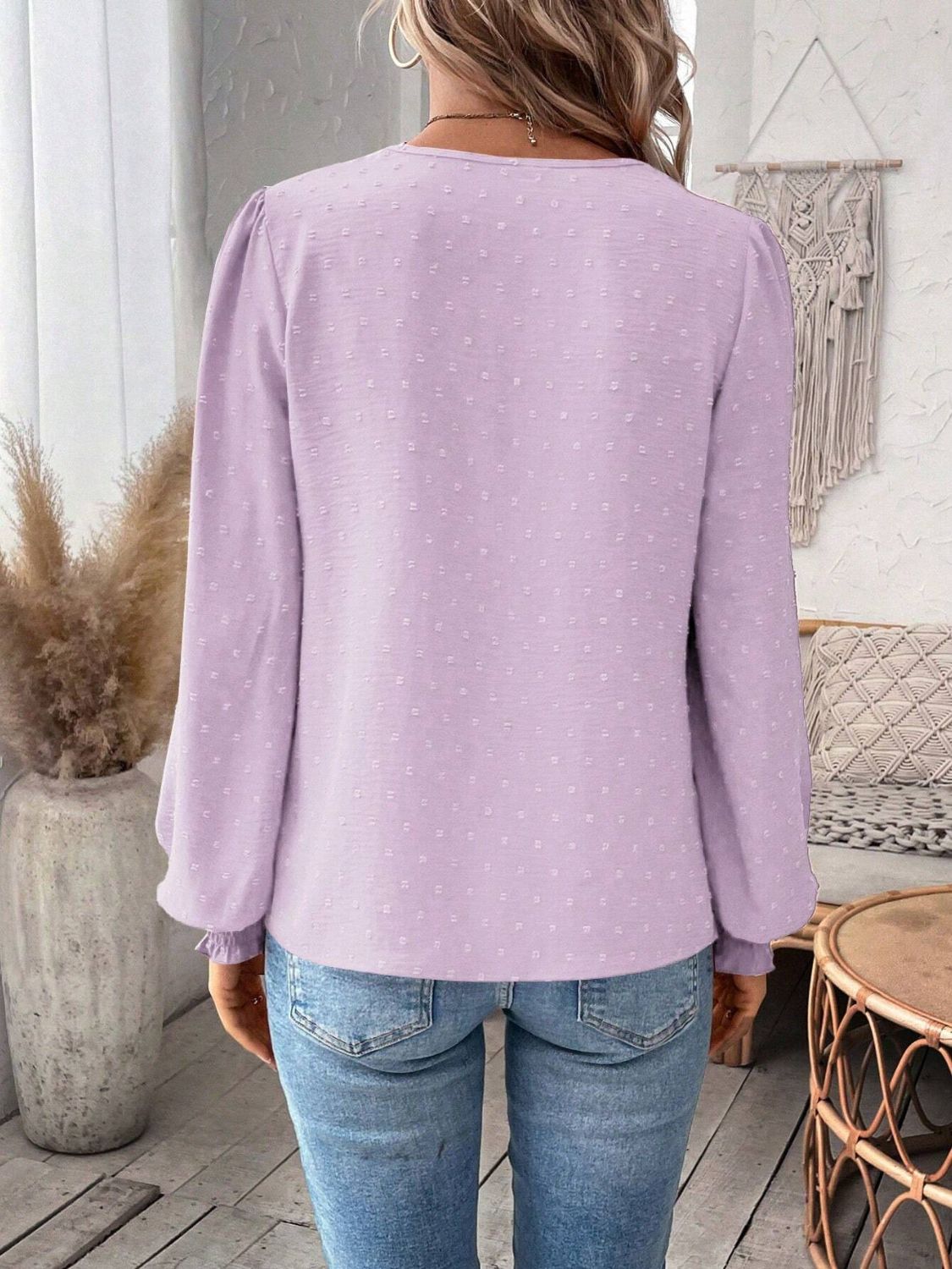 Lilac textured blouse with puff sleeves and embroidered yoke detail.