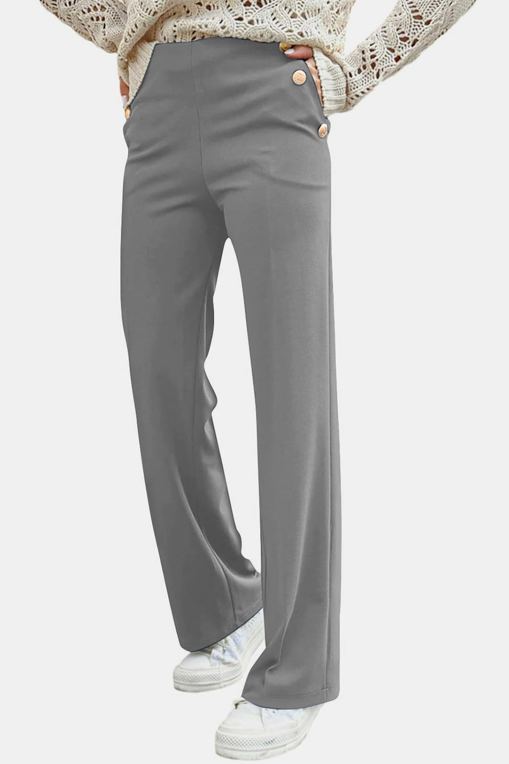Gray wide leg trousers with button detail and a high waist.